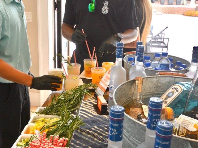 An Executive Beverage mobile bartender working a bar rental at a Hampton Roads party.
