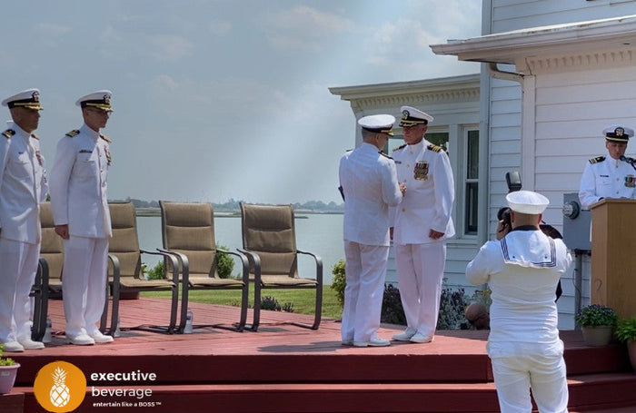 U.S. Navy officers in dress whites at a Veterans Day ceremony in Hampton Roads.