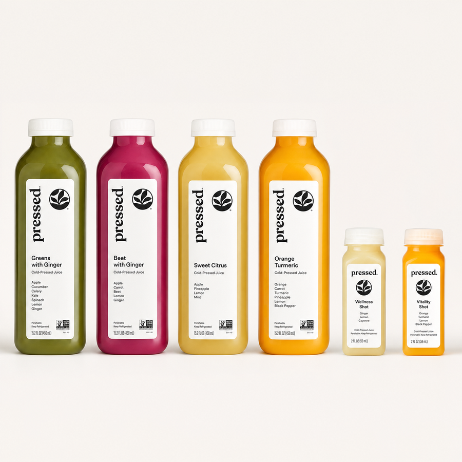 Cold-pressed juices in greens, beet, sweet citrus and orange turmeric alongside two wellness shots, bottled for event service.