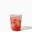 Load image into Gallery viewer, Clear plastic cup with red iced drink on a white background
