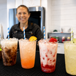 Load image into Gallery viewer, An Executive Beverage bartender behind a row of dirty sodas in Virginia Beach

