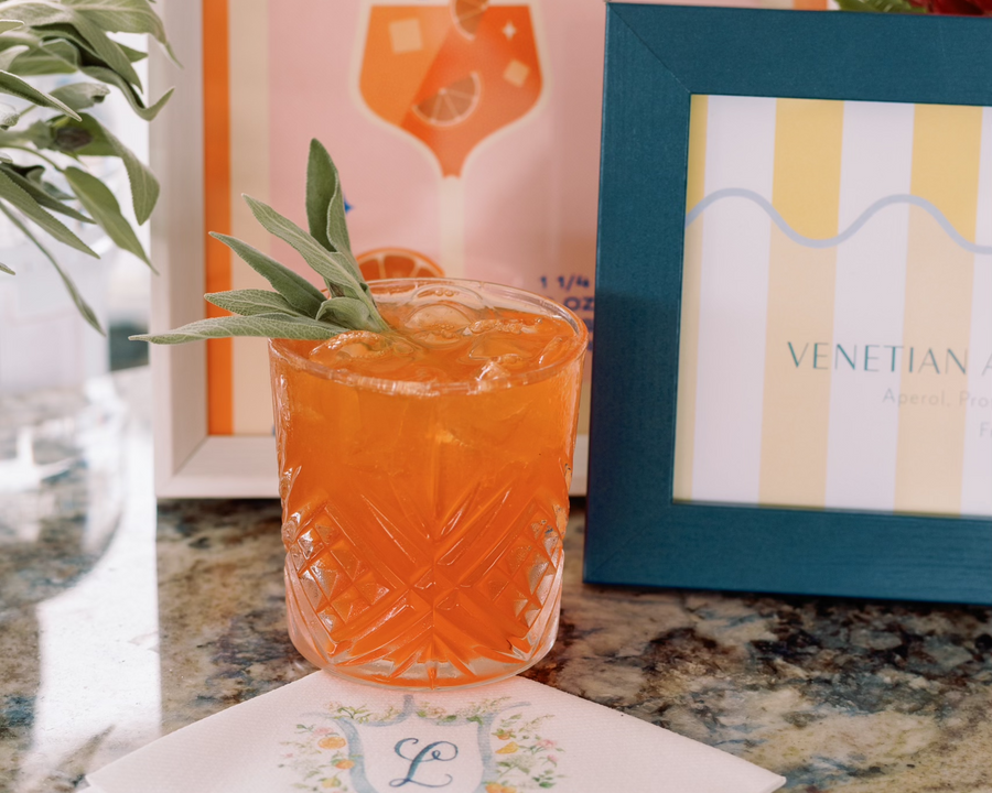 French rocks glasses from the Executive Beverage glassware rental range, filled with an Aperol spritz.
