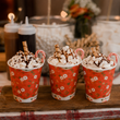 Load image into Gallery viewer, Hot chocolates topped with whipped cream and a chocolate stick
