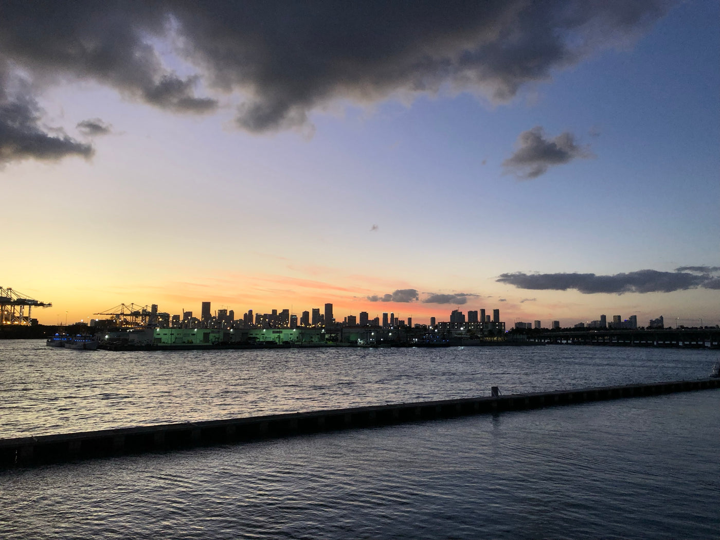 The Miami skyline at sunset seen from the water during a yacht charter event served by Executive Beverage.