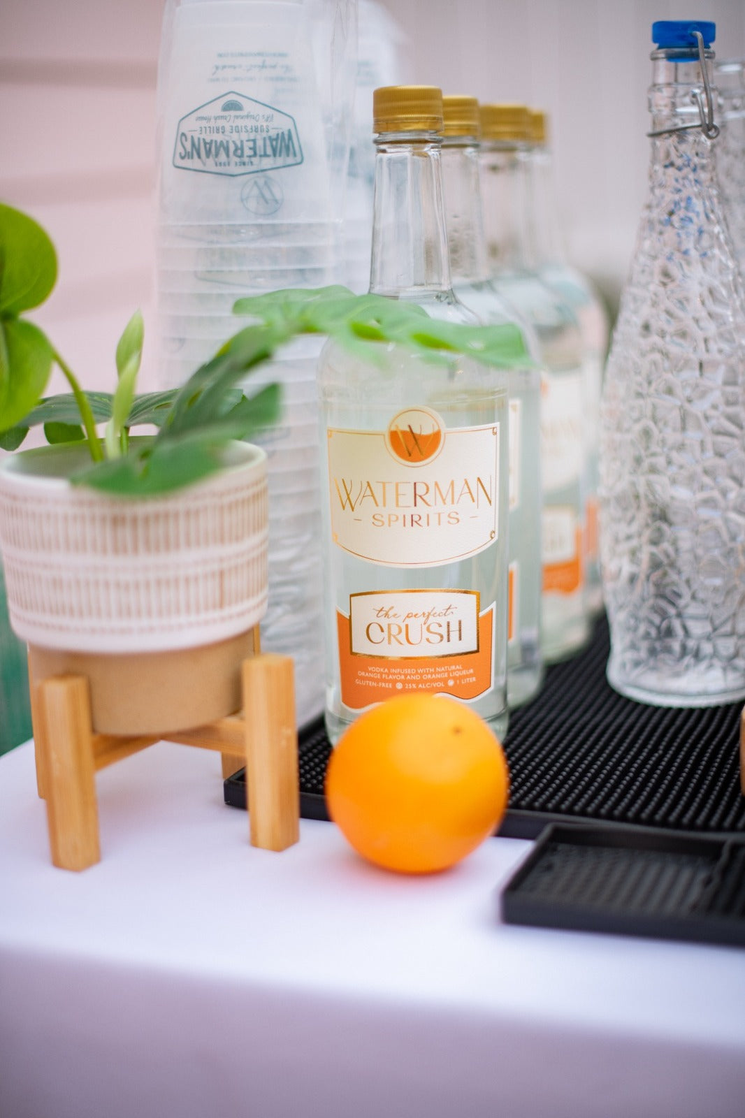 Waterman's Perfect Crush bottles and Executive Beverage cups set up on a crush bar at a Virginia Beach event