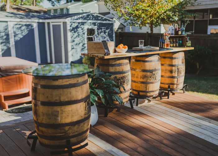 The Total Barrel Package — four authentic whiskey barrels with an 8 ft acacia bar top
